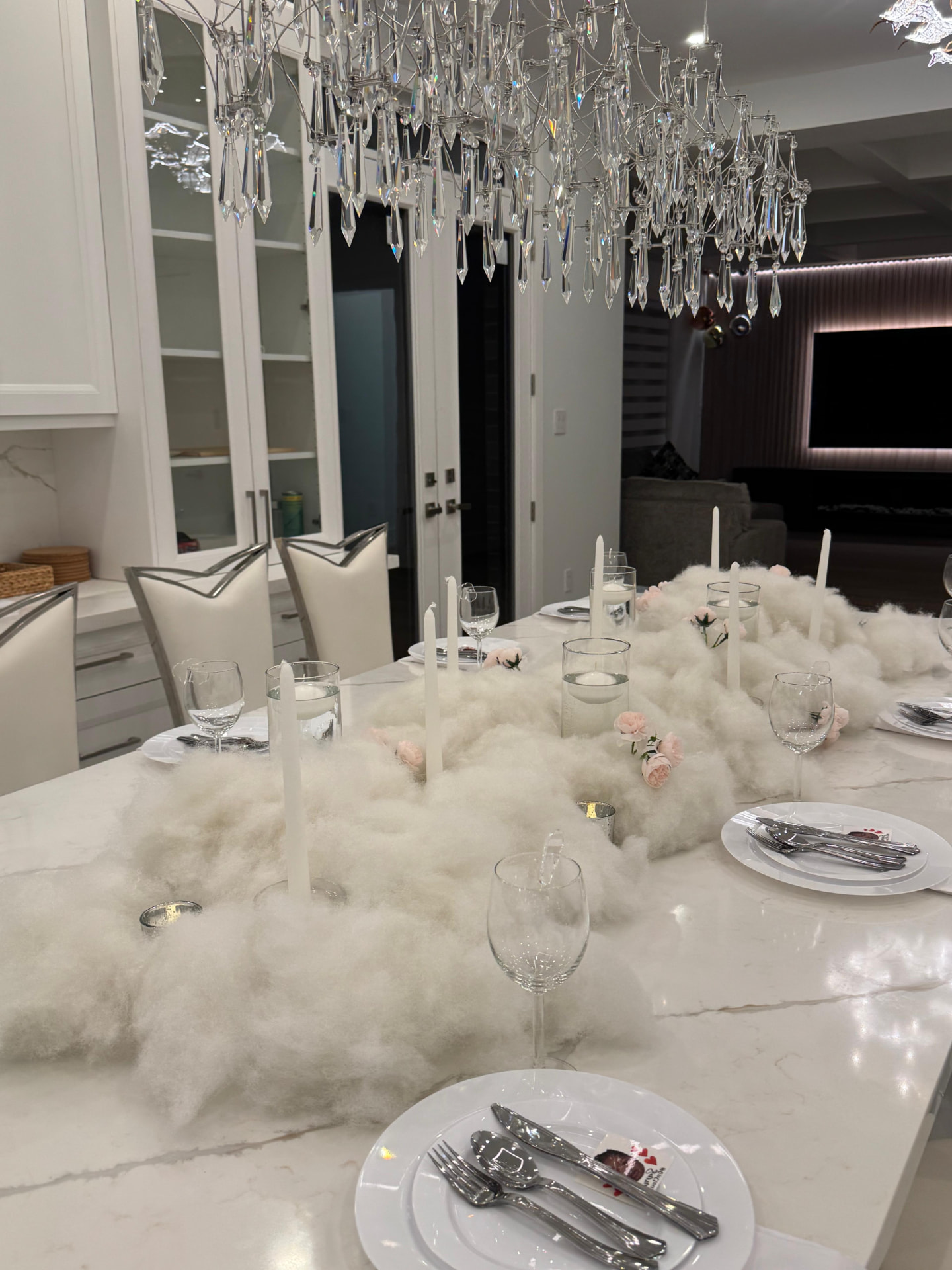 Cloud-themed marble table with tapers and blush roses